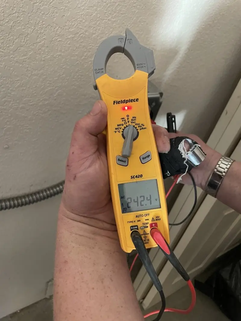 Voltage testing with clamp meter during Electrical Installation Services in Glassport